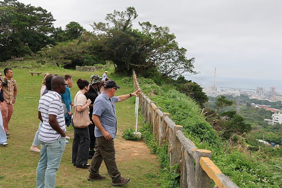 Visitors overlooking the landscape from Hacksaw Ridge at Maeda Escarpment
